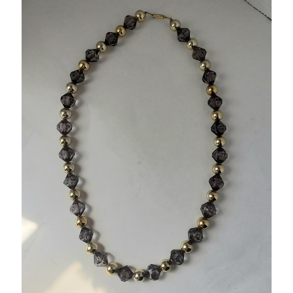 Gray and Gold Costume Jewelry with "me" on the Tag